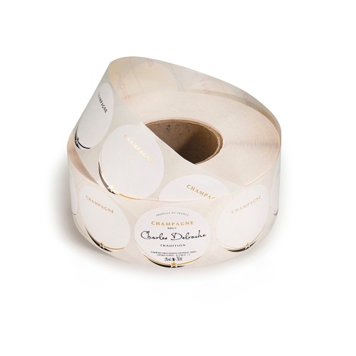 Rouleau d'étiquettes rondes blanches avec un liseré et une étoile or